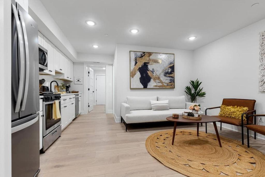 a living room with a couch and a table at Excellent 2-BR Condo in Hip Area of DC in Washington, D.C.