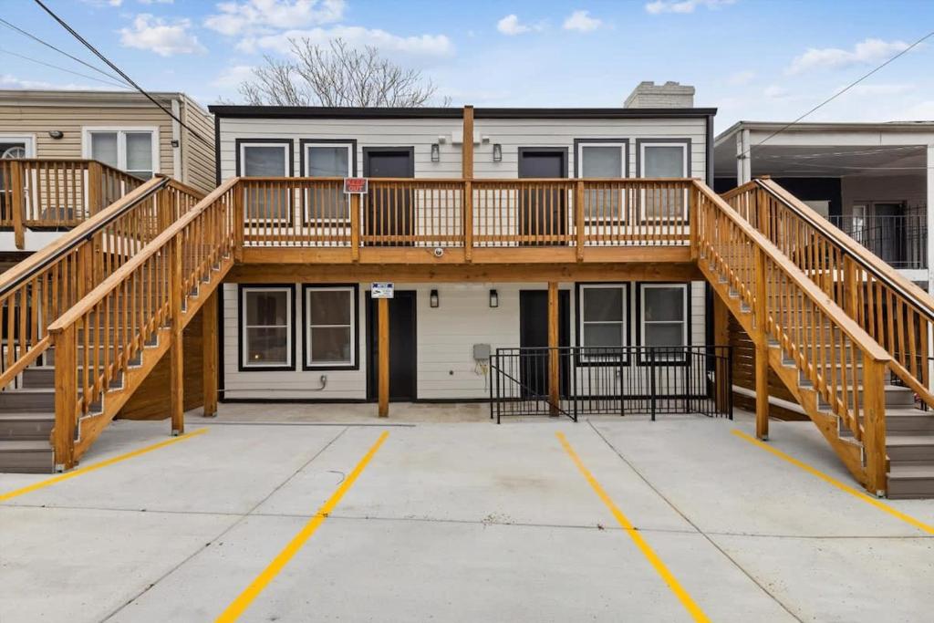 a house with a wooden deck on top of it at Excellent 2-BR Condo in Hip Area of DC in Washington, D.C.