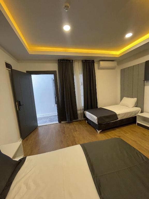 Postel nebo postele na pokoji v ubytování Mi Hotel Boutique