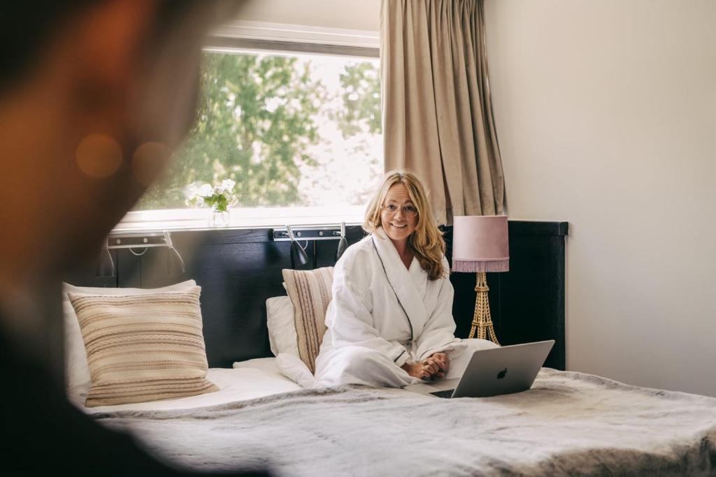 Postel nebo postele na pokoji v ubytování Sigtunahöjden Hotell & Konferens