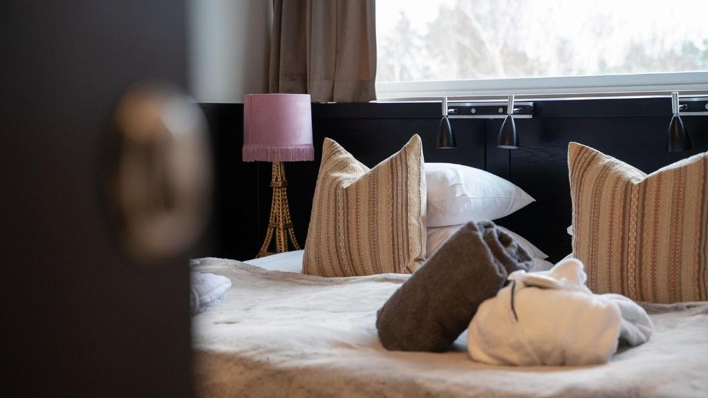 Postel nebo postele na pokoji v ubytování Sigtunahöjden Hotell & Konferens