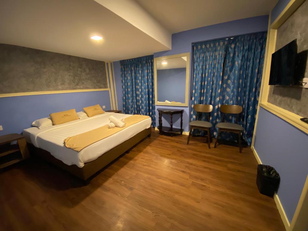 Postel nebo postele na pokoji v ubytování Suria Cameron Hotel