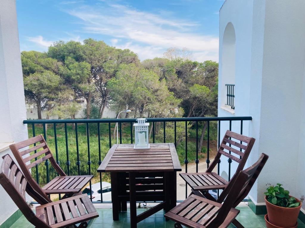 a table and two chairs on a balcony with a view at Holiday Home La Atalaya de Conil in Conil de la Frontera
