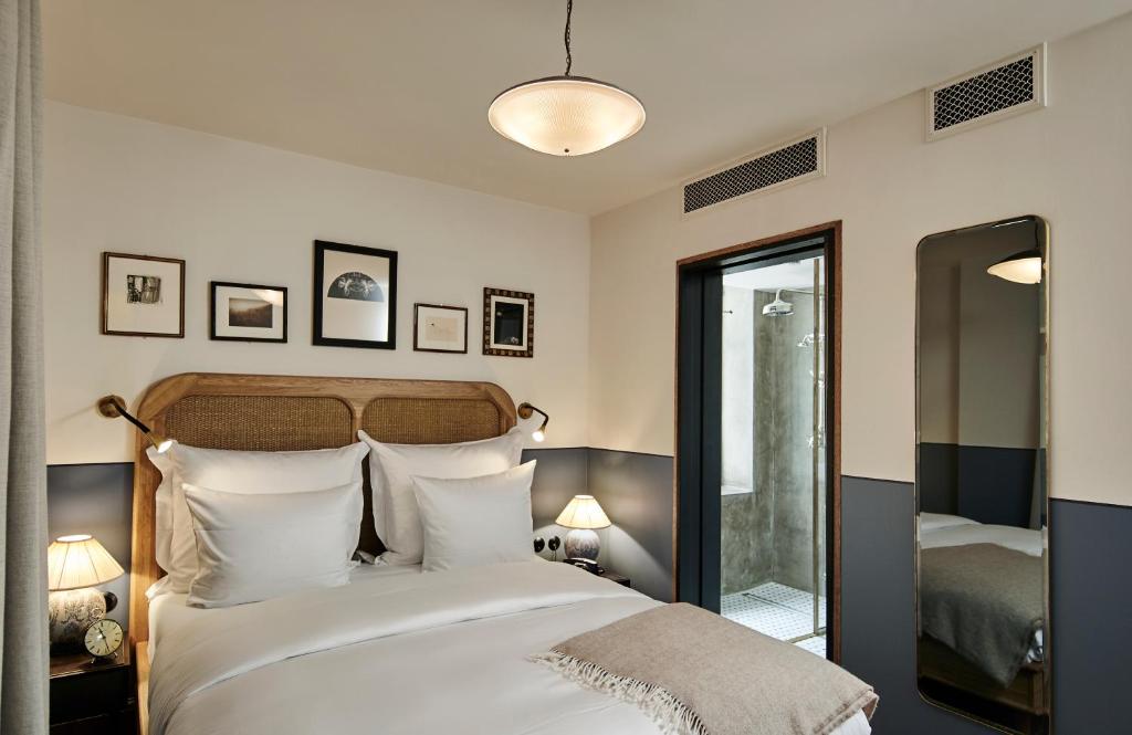 Postel nebo postele na pokoji v ubytování Hotel Sanders