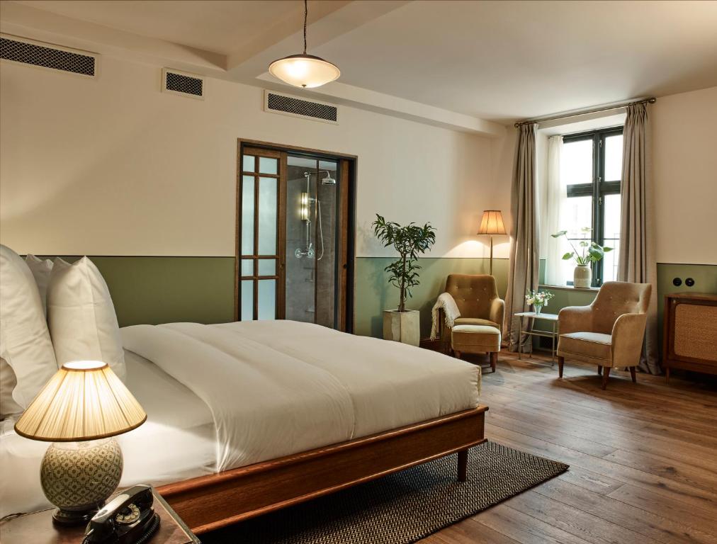 Postel nebo postele na pokoji v ubytování Hotel Sanders