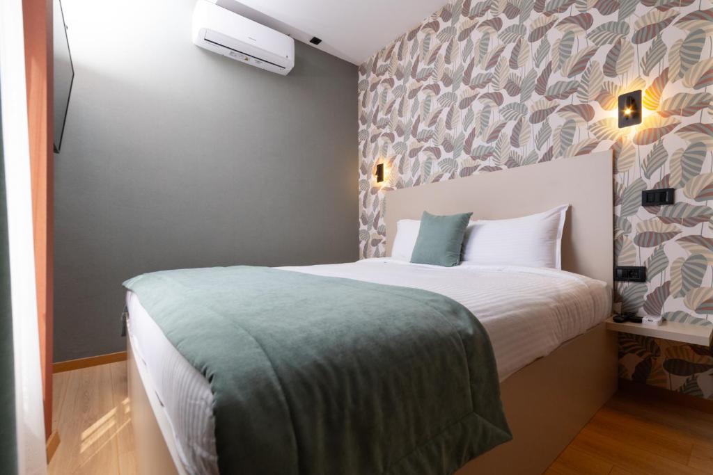 Postel nebo postele na pokoji v ubytování Hotel Ma Belle