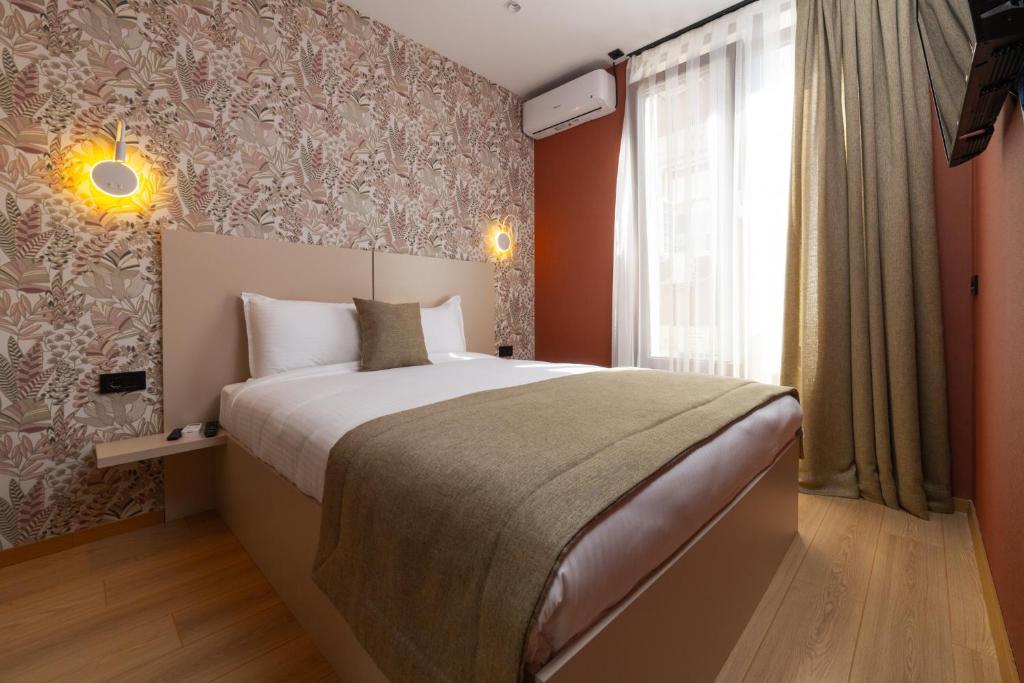 Postel nebo postele na pokoji v ubytování Hotel Ma Belle
