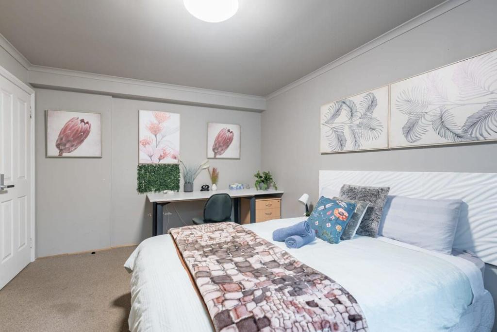 a bedroom with a bed and a desk in it at Boutique Private Rm 7 Min Walk to Sydney Domestic Airport - SHAREHOUSE in Sydney