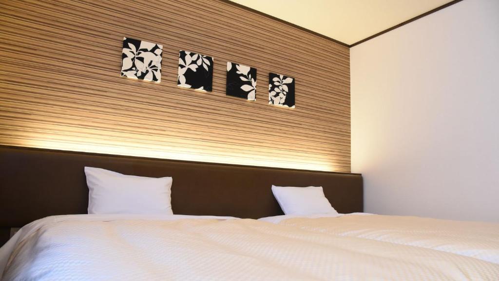 Postel nebo postele na pokoji v ubytování Hotel Yume-no-yu