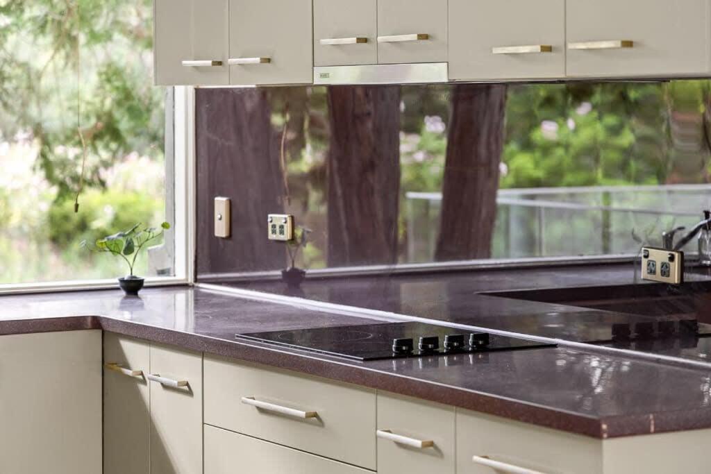 a kitchen with a black counter top and a window at Single Room in Pymble Sleeps 1 in Pymble
