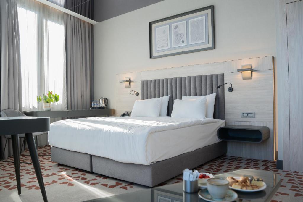 Postel nebo postele na pokoji v ubytování Best Western Plus Hotel Konak