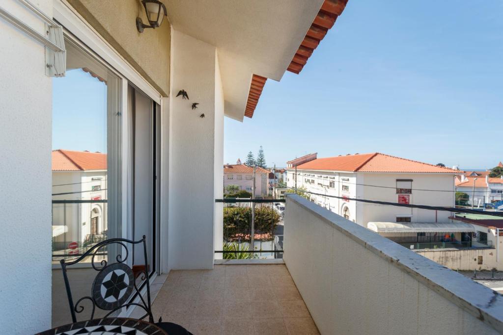 a balcony with a view of a building at Beach House Cascais in Estoril