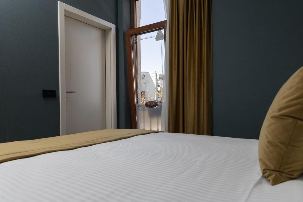 Postel nebo postele na pokoji v ubytování Hotel Ma Belle