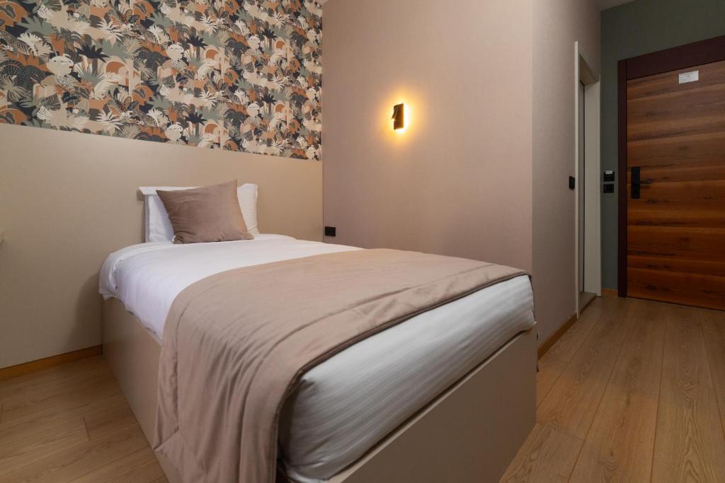 Postel nebo postele na pokoji v ubytování Hotel Ma Belle