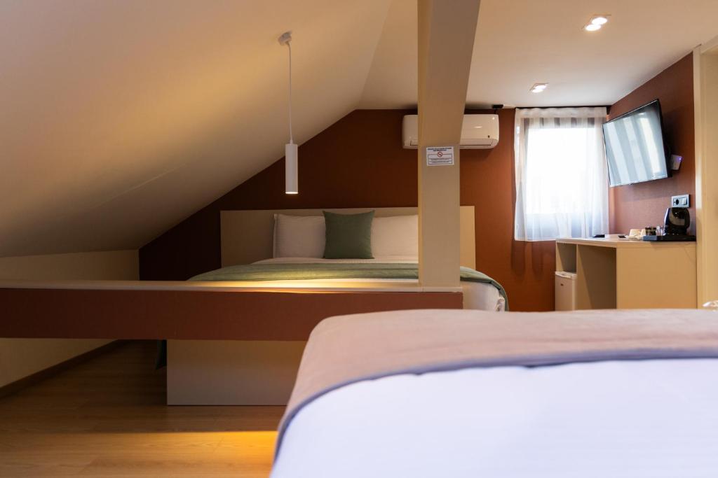 Postel nebo postele na pokoji v ubytování Hotel Ma Belle