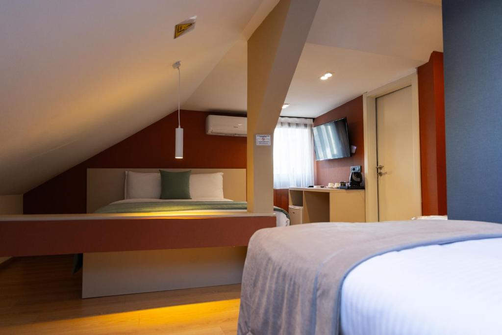 Postel nebo postele na pokoji v ubytování Hotel Ma Belle