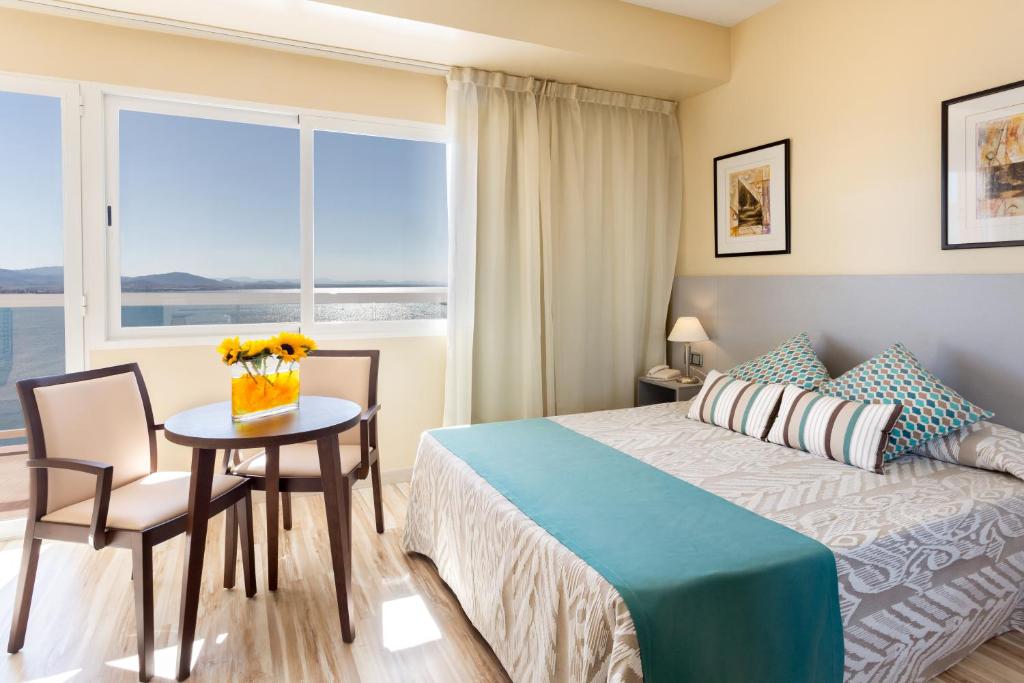 Postel nebo postele na pokoji v ubytování Hotel Izán Cavanna