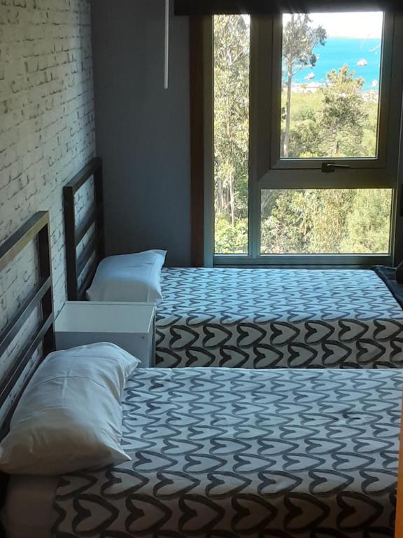 A bed or beds in a room at O IGREXARIO