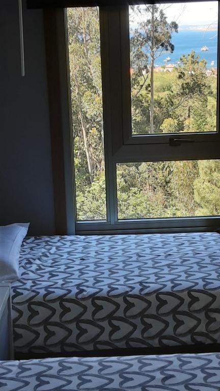 A bed or beds in a room at O IGREXARIO