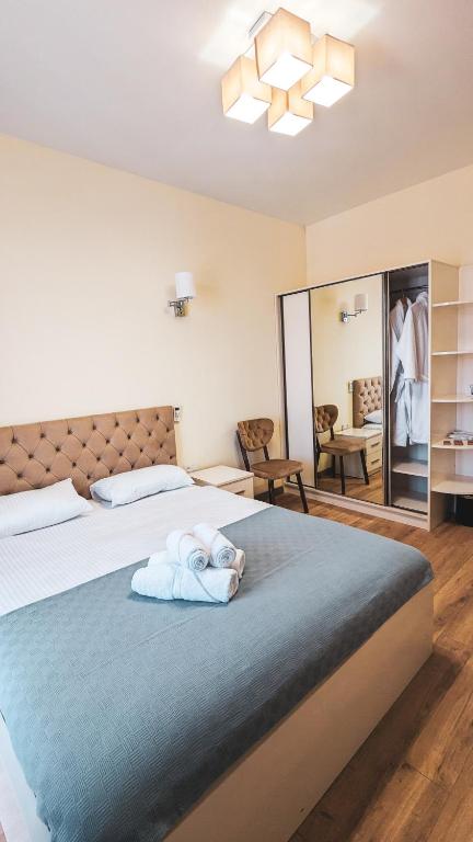 Postel nebo postele na pokoji v ubytování GG ApartHotel