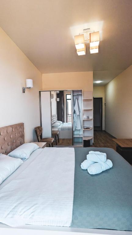 Postel nebo postele na pokoji v ubytování GG ApartHotel