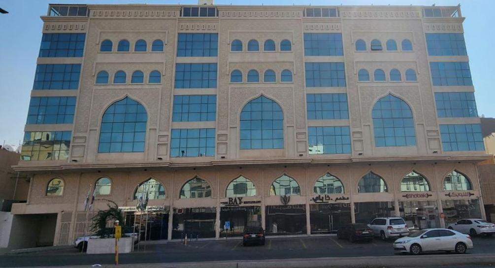 a large building with cars parked in front of it at فندق جرين ليف in Jeddah