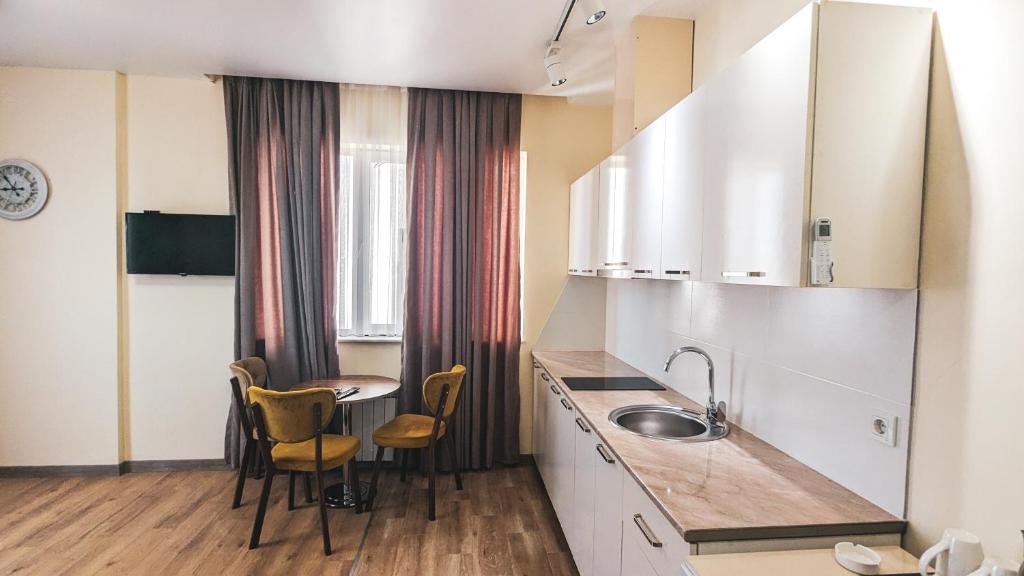 Kuchyň nebo kuchyňský kout v ubytování GG ApartHotel