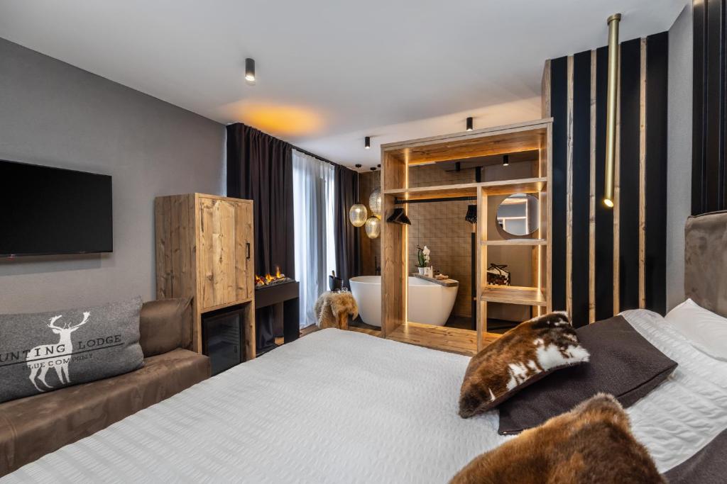 Postel nebo postele na pokoji v ubytování Hotel Folgarida