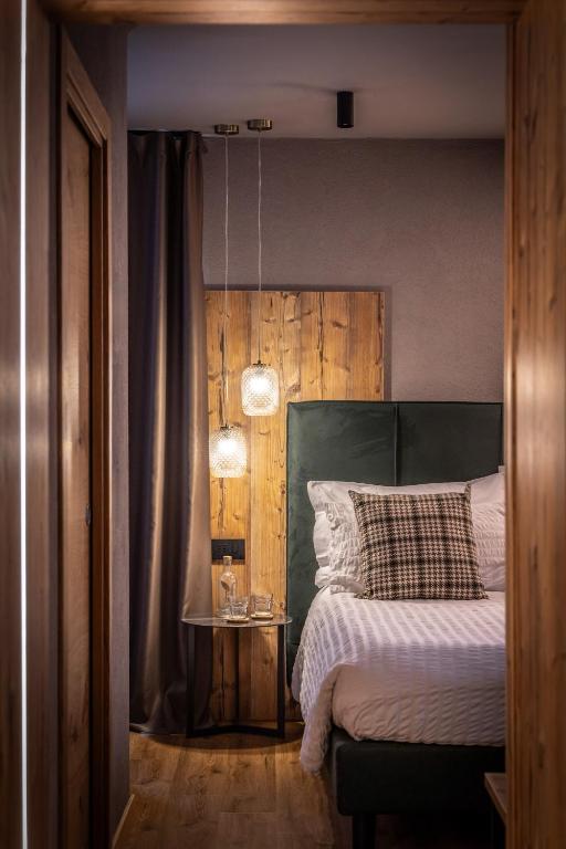 Postel nebo postele na pokoji v ubytování Hotel Folgarida