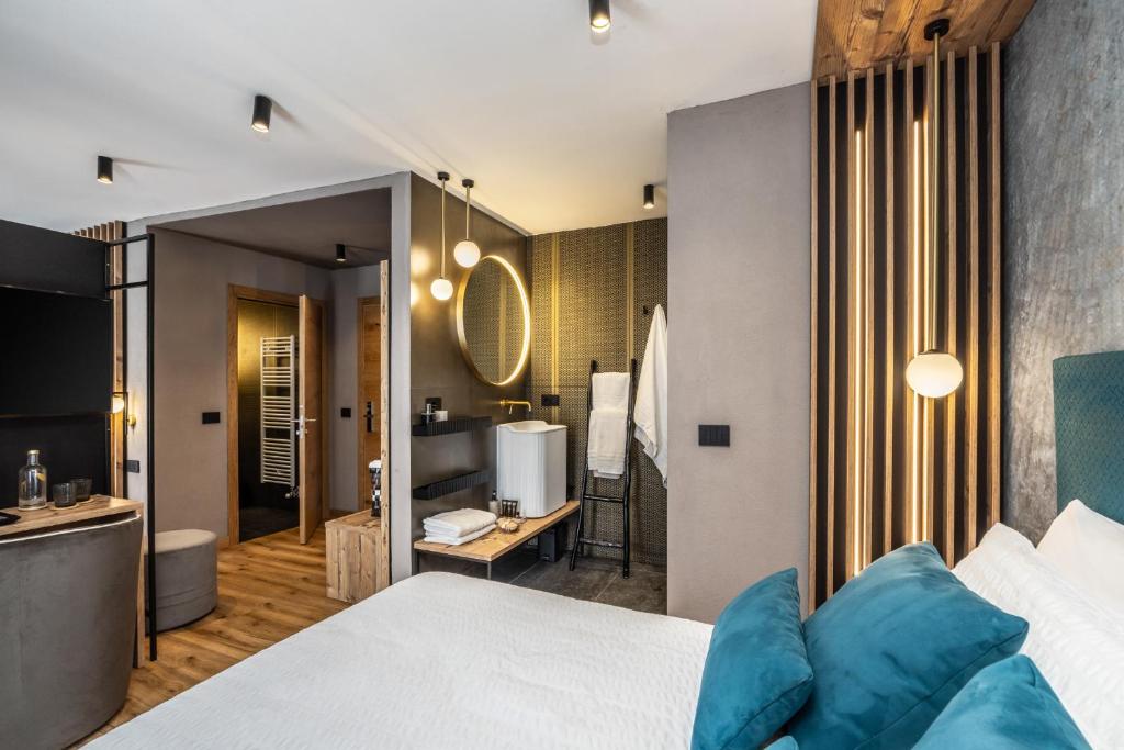 Postel nebo postele na pokoji v ubytování Hotel Folgarida