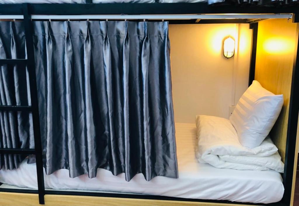Postel nebo postele na pokoji v ubytování HOSTEL ECO TOURISM CẦN GIỜ