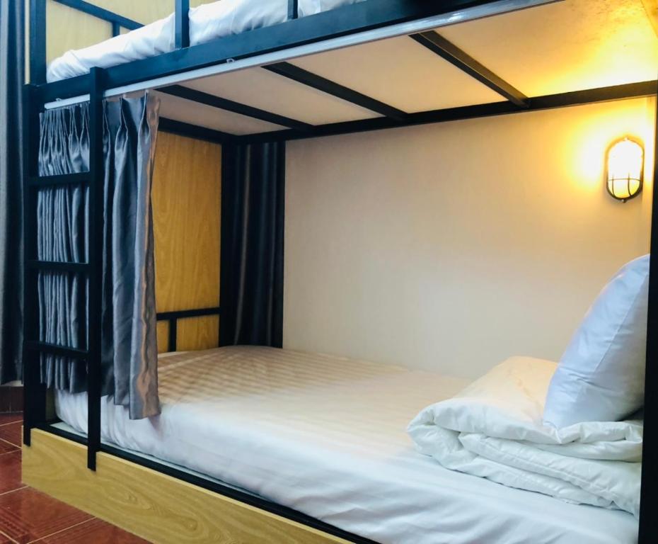 Postel nebo postele na pokoji v ubytování HOSTEL ECO TOURISM CẦN GIỜ