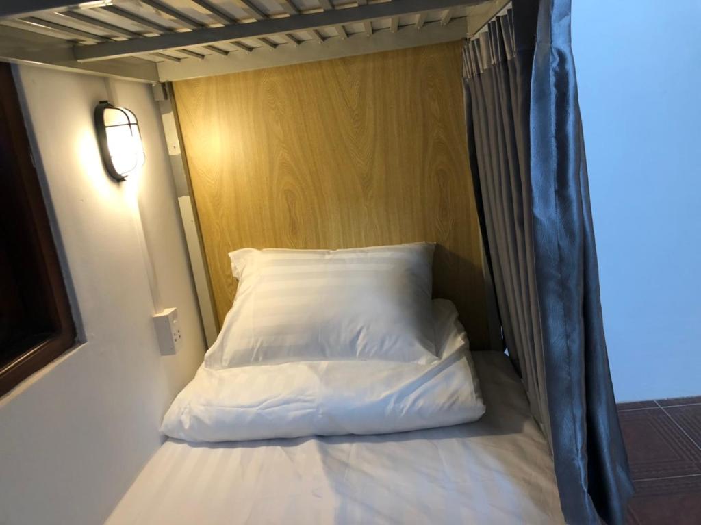 Postel nebo postele na pokoji v ubytování HOSTEL ECO TOURISM CẦN GIỜ