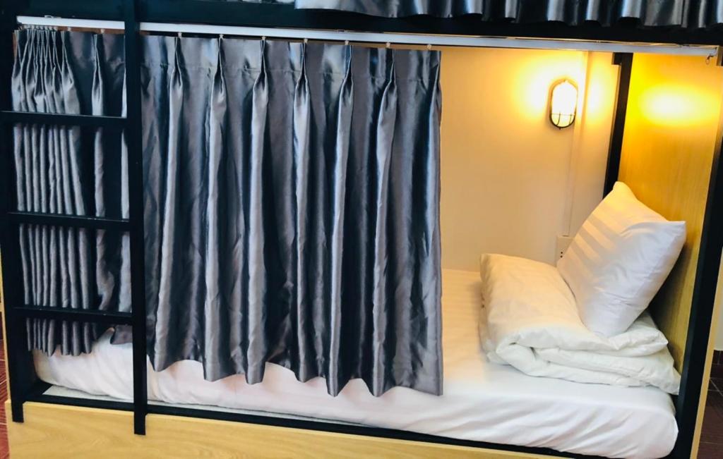 Postel nebo postele na pokoji v ubytování HOSTEL ECO TOURISM CẦN GIỜ