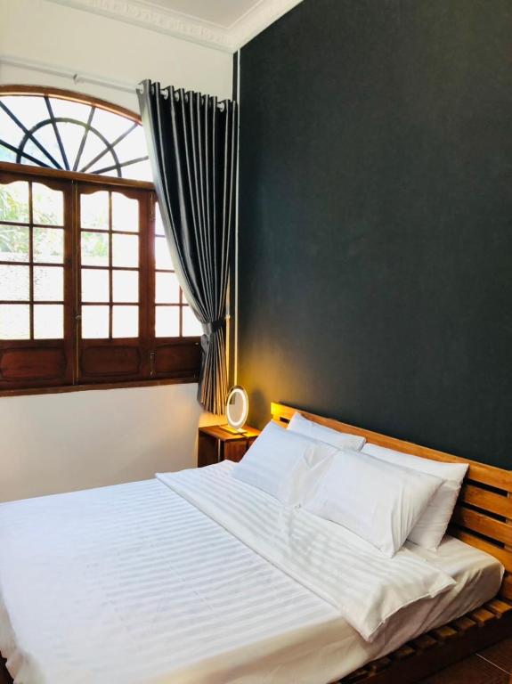 Postel nebo postele na pokoji v ubytování HOSTEL ECO TOURISM CẦN GIỜ