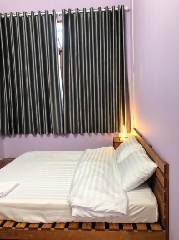 Postel nebo postele na pokoji v ubytování HOSTEL ECO TOURISM CẦN GIỜ