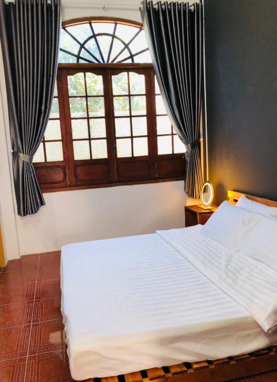 Postel nebo postele na pokoji v ubytování HOSTEL ECO TOURISM CẦN GIỜ
