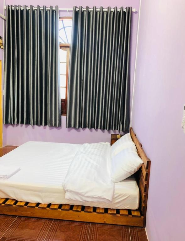 Postel nebo postele na pokoji v ubytování HOSTEL ECO TOURISM CẦN GIỜ