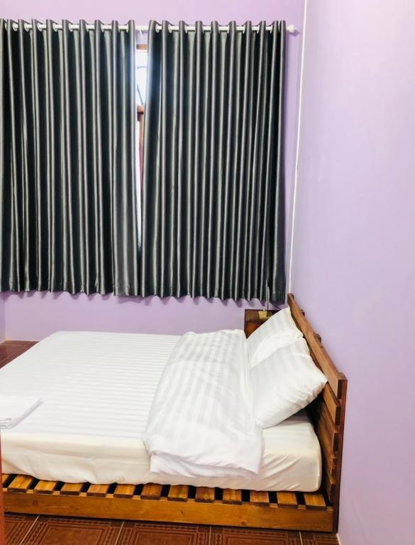 Postel nebo postele na pokoji v ubytování HOSTEL ECO TOURISM CẦN GIỜ