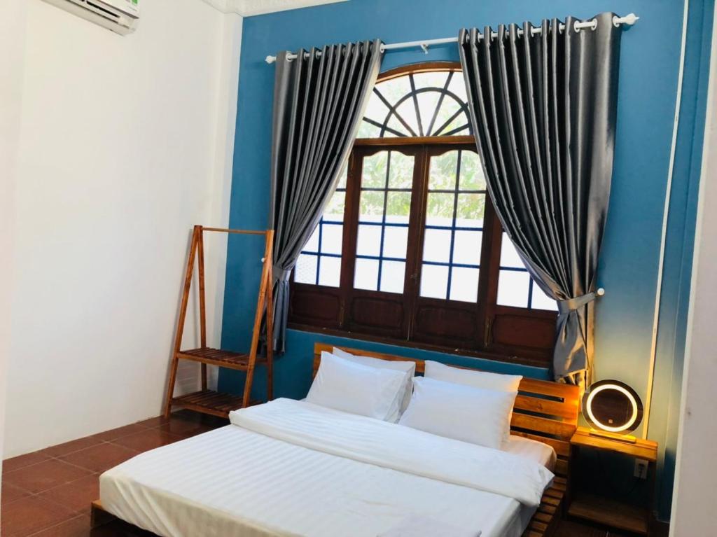 Postel nebo postele na pokoji v ubytování HOSTEL ECO TOURISM CẦN GIỜ