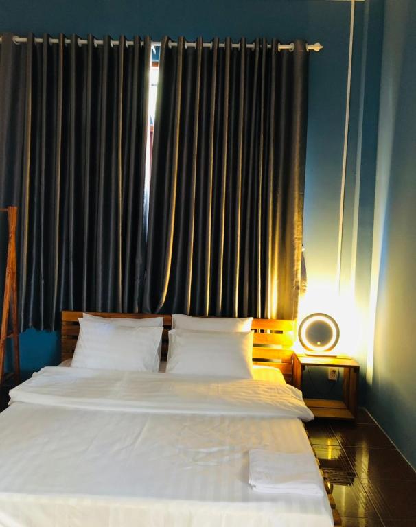 Postel nebo postele na pokoji v ubytování HOSTEL ECO TOURISM CẦN GIỜ