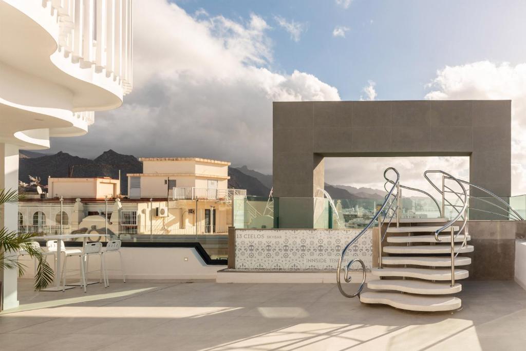 a balcony with stairs and a view of buildings at INNSiDE by Meliá Tenerife Santa Cruz in Santa Cruz de Tenerife