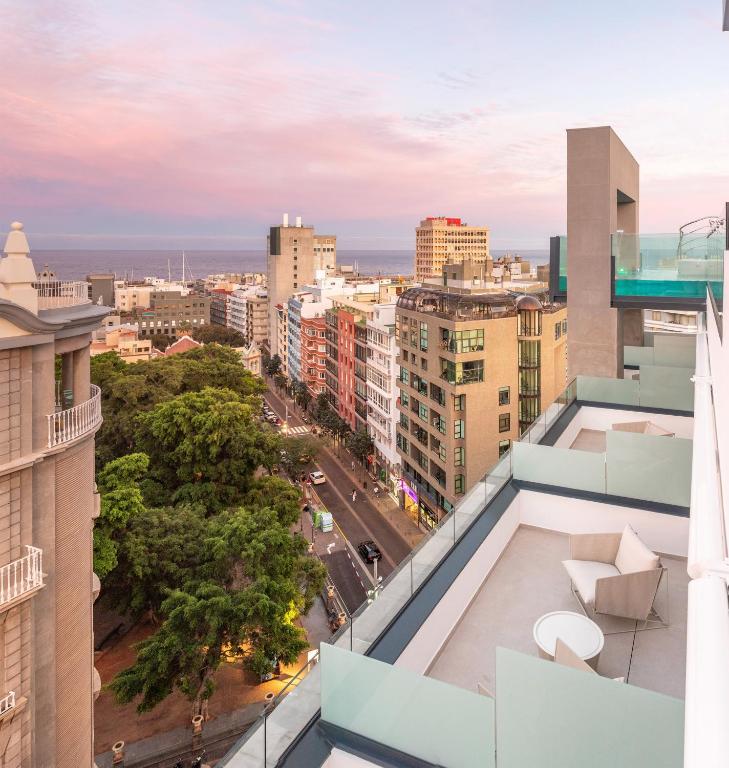a view of the city from the balcony of a building at INNSiDE by Meliá Tenerife Santa Cruz in Santa Cruz de Tenerife