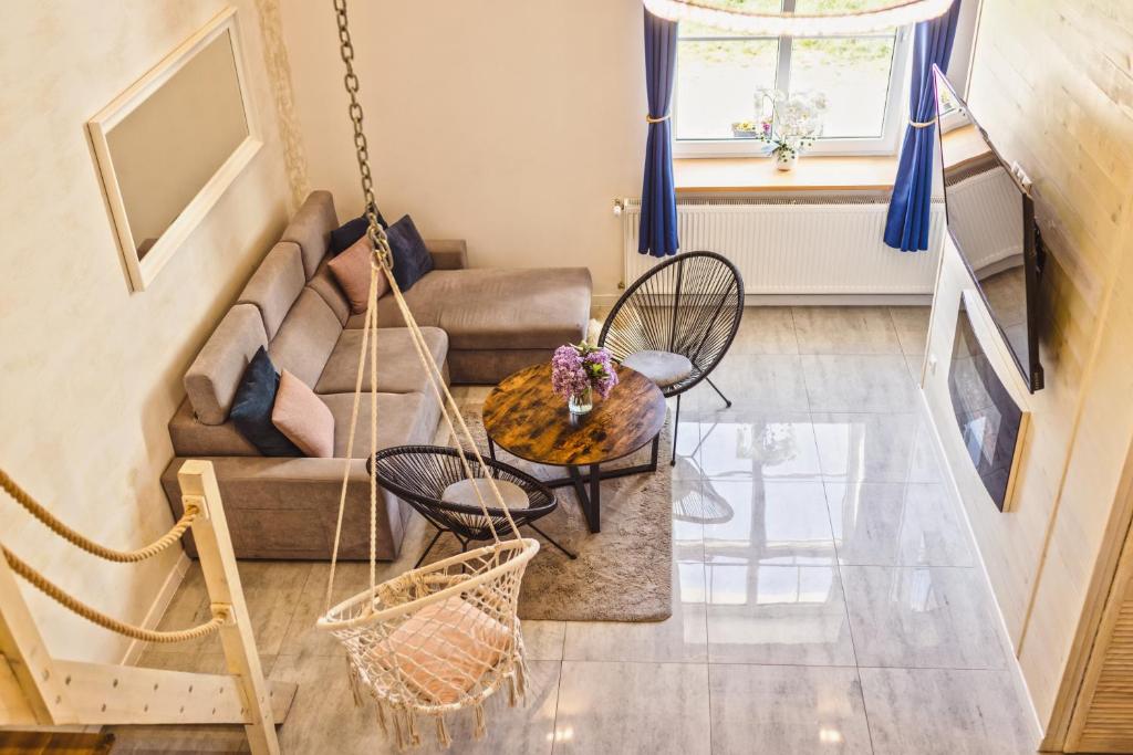 Televízia a/alebo spoločenská miestnosť v ubytovaní Apartament Plus