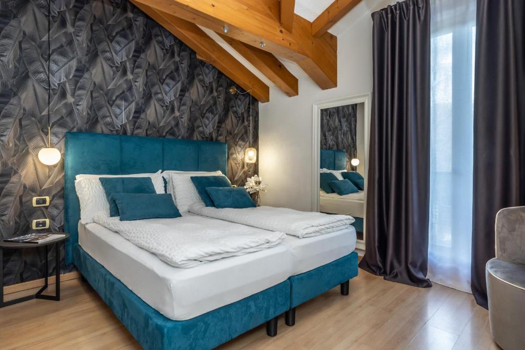 Postel nebo postele na pokoji v ubytování Hotel Folgarida