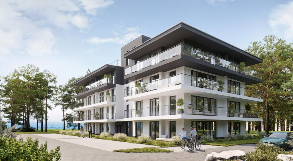 a rendering of a building with people on bikes in front of it at HEVENIA POGORZELICA - APARTAMENT 2 in Pogorzelica