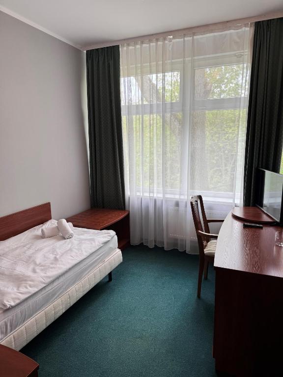 Postel nebo postele na pokoji v ubytování Geovita w Jadwisinie