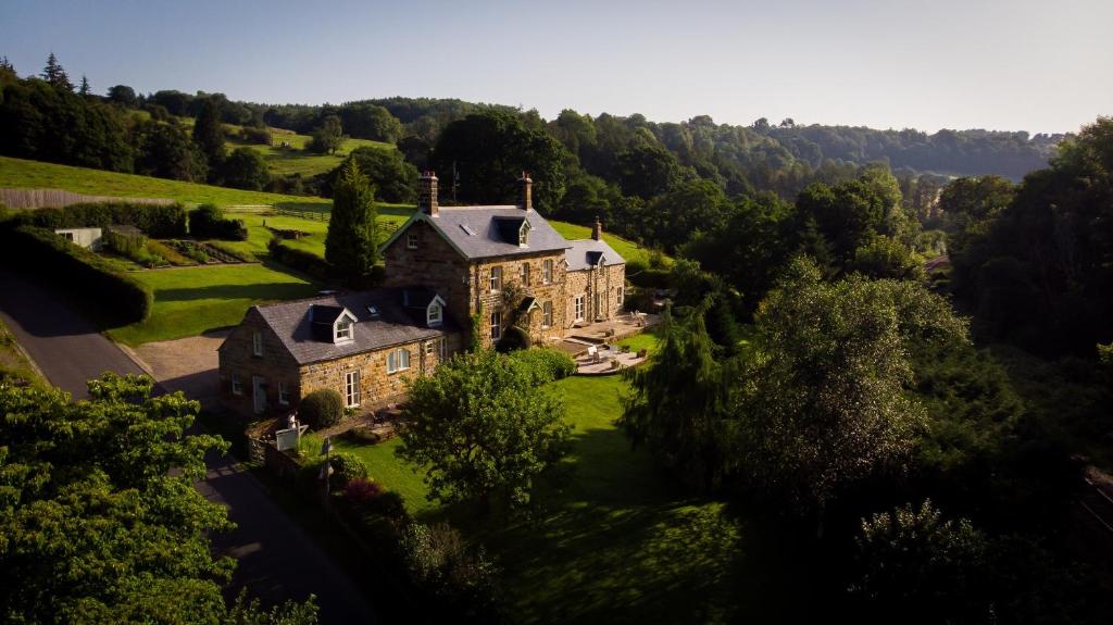 an aerial view of a large house on a hill at Broom House at Egton Bridge in Egton