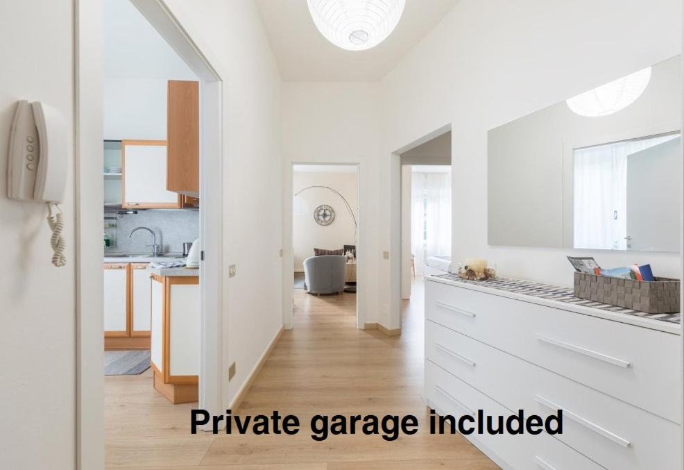 a kitchen with white walls and a white counter top at Lovely, charming and quiet apartment in the centre air conditioned and free private garage in Como