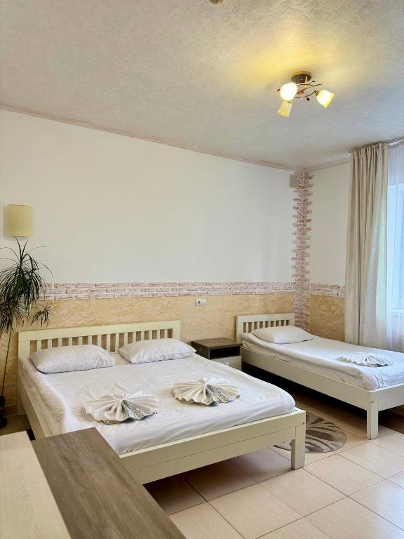Postel nebo postele na pokoji v ubytování Trio Hotel Restaurant